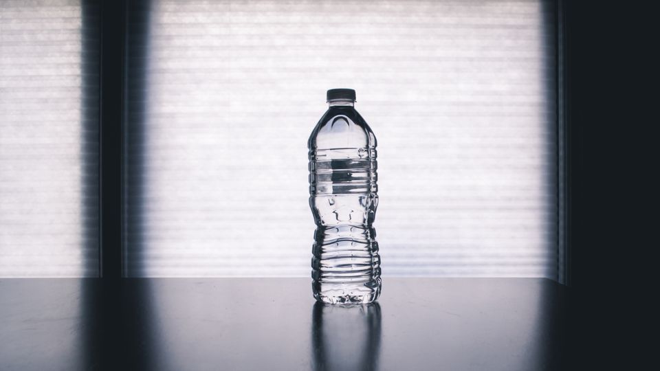 Pouring clear water into a glass