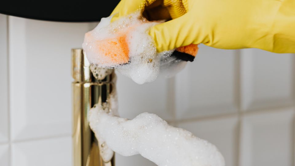 Hand cleaning a bathroom faucet aerator